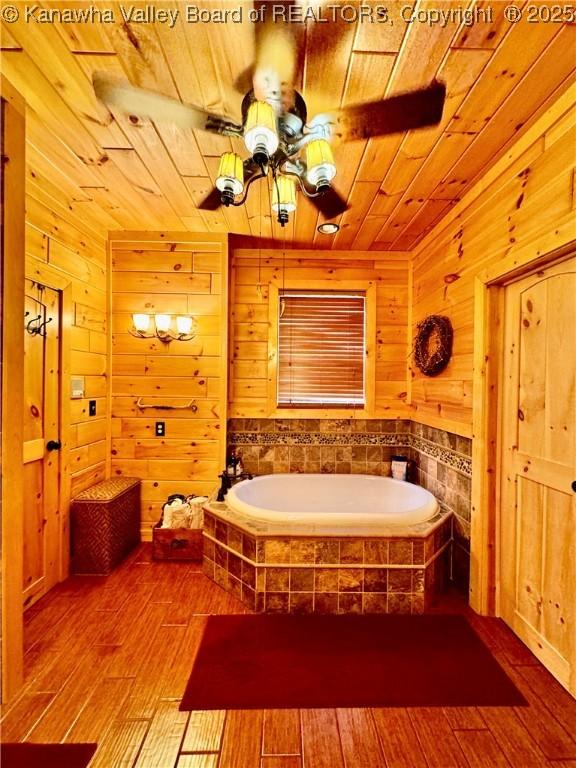 2299 Striker Fork Rd, Chapmanville, WV 25508 - full bath featuring wood ceiling, a garden tub, wood walls, and hardwood / wood-style floors