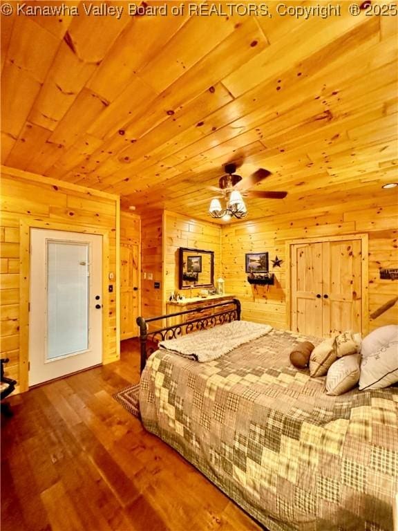 2299 Striker Fork Rd, Chapmanville, WV 25508 - bedroom featuring wood walls, wood finished floors, and wood ceiling