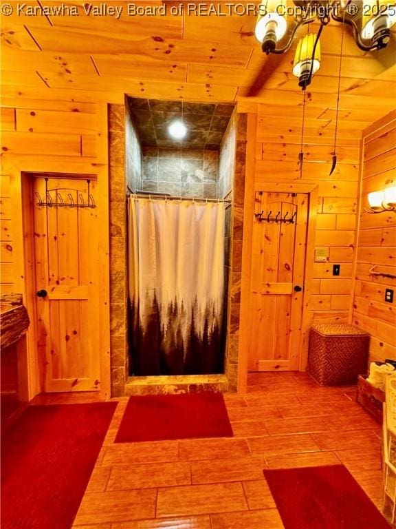 2299 Striker Fork Rd, Chapmanville, WV 25508 - full bathroom featuring wood walls, wood finished floors, and a shower with curtain