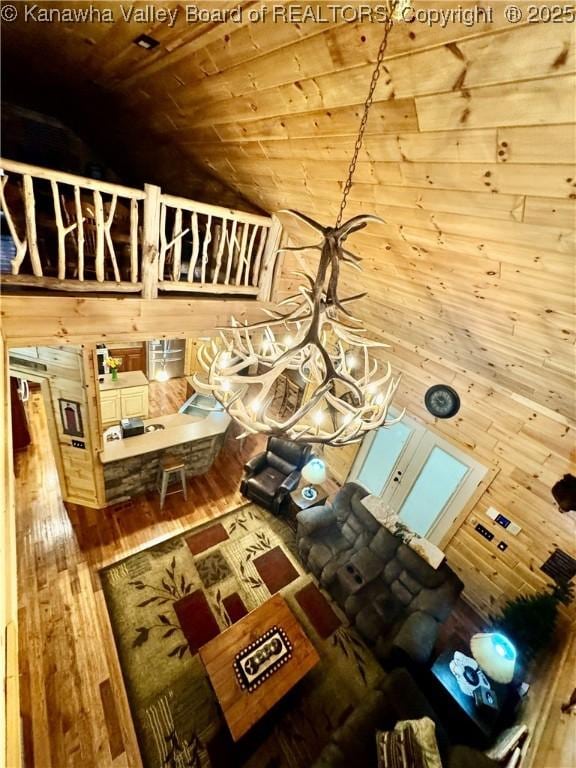 2299 Striker Fork Rd, Chapmanville, WV 25508 - living room with wood walls, hardwood / wood-style floors, wooden ceiling, and vaulted ceiling