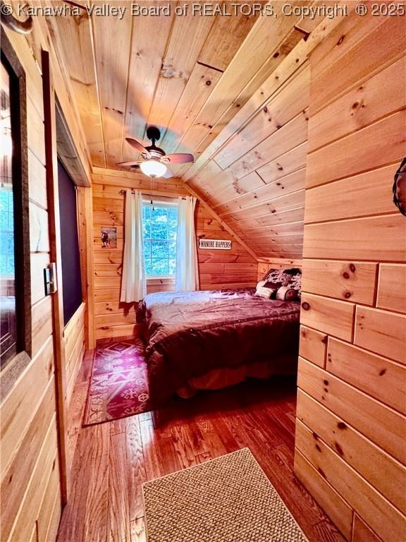 2299 Striker Fork Rd, Chapmanville, WV 25508 - bedroom featuring wood-type flooring, wooden ceiling, wood walls, and lofted ceiling