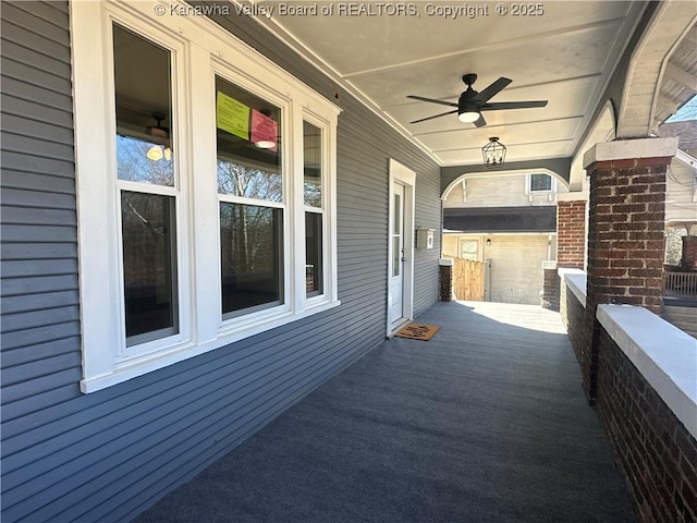 view of patio / terrace with ceiling fan and a porch