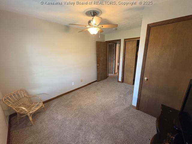 unfurnished bedroom with multiple closets, carpet flooring, and baseboards