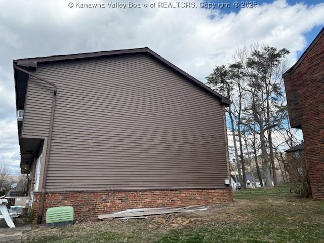 view of home's exterior featuring brick siding