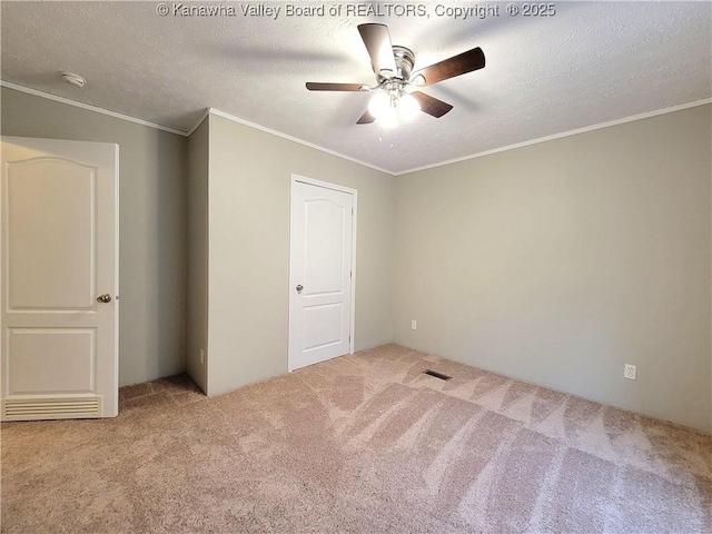 unfurnished bedroom featuring ornamental molding and carpet flooring