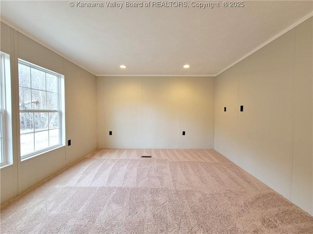 carpeted empty room featuring ornamental molding and recessed lighting