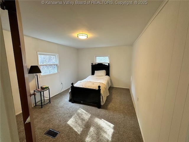 carpeted bedroom with visible vents