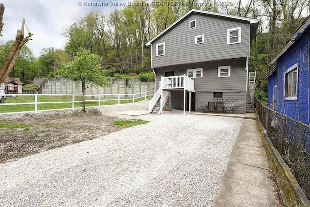 exterior space with stairway and fence