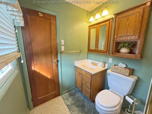 half bath with vanity and toilet