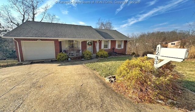 ranch-style house featuring concrete driveway, brick siding, an attached garage, and roof with shingles