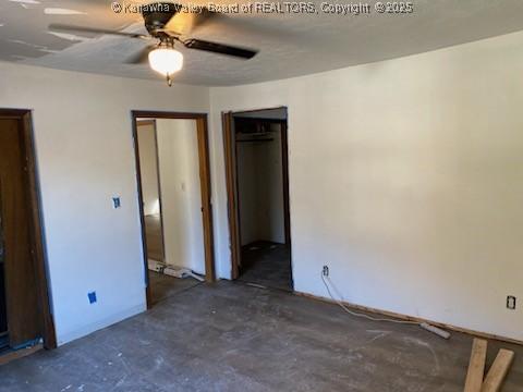 unfurnished bedroom featuring ceiling fan