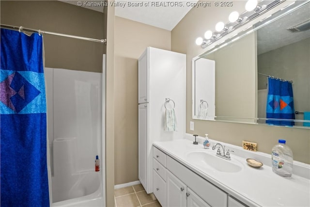 bathroom with visible vents, vanity, and tile patterned floors