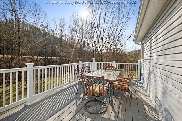 deck featuring outdoor dining area