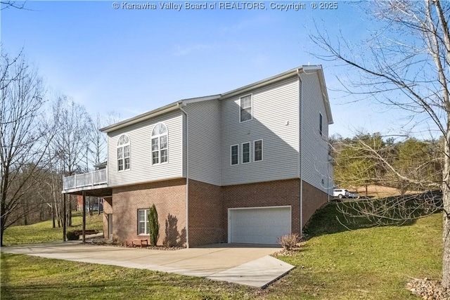 exterior space with driveway, a garage, a lawn, and brick siding