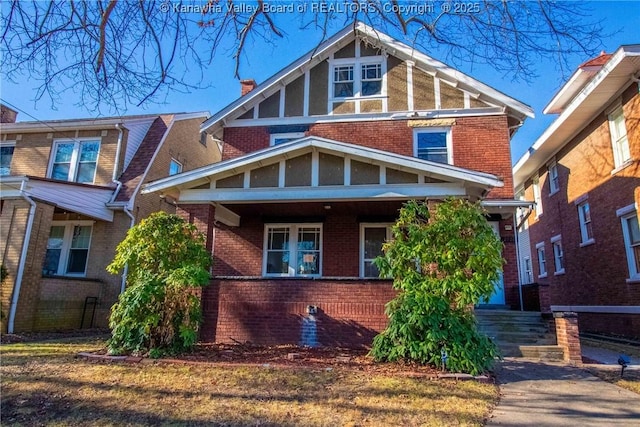 view of front of house with brick siding