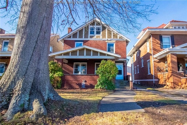 view of front facade featuring a porch and brick siding