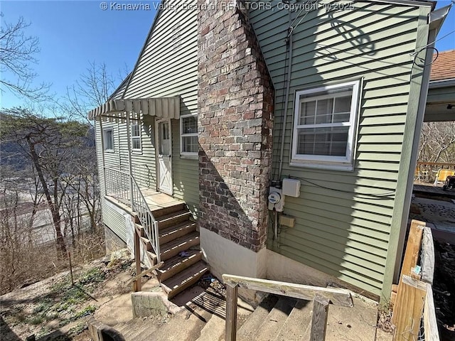 view of property exterior featuring brick siding