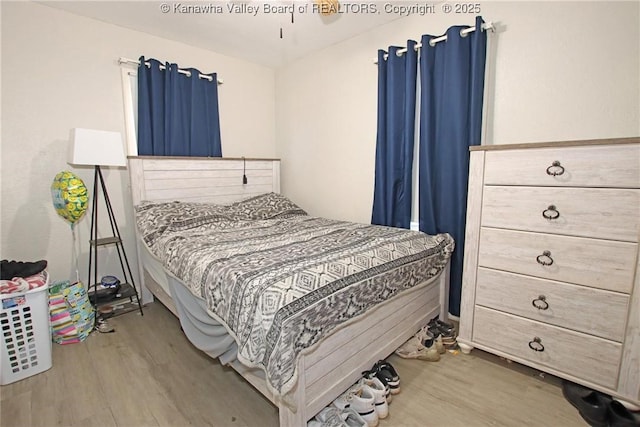 bedroom with wood finished floors