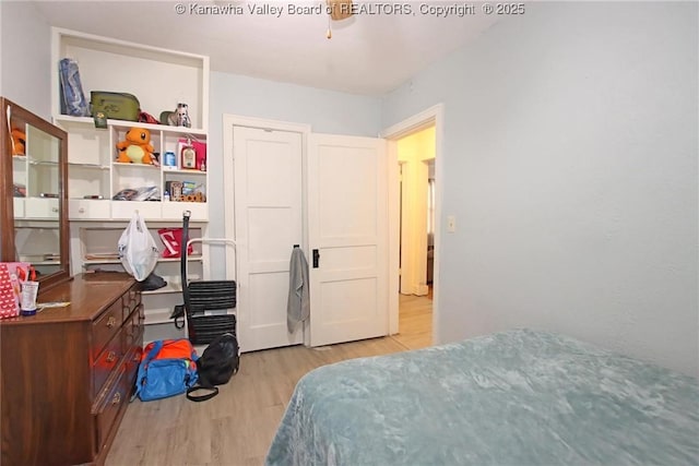 bedroom with wood finished floors