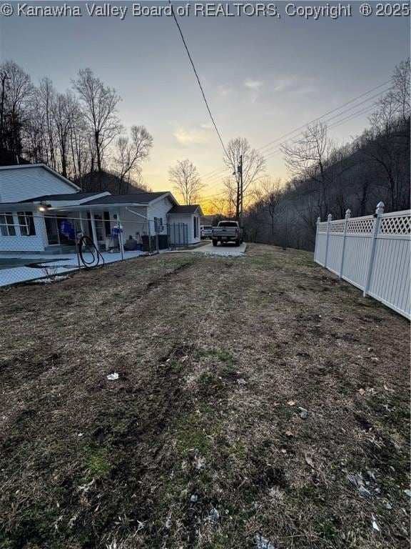 yard at dusk with fence