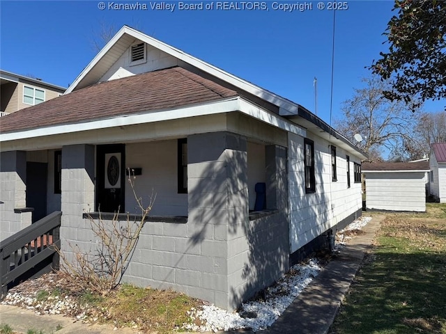 view of property exterior featuring roof with shingles