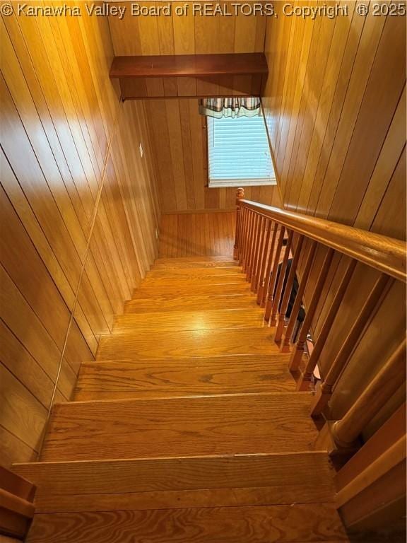 stairs with wood finished floors