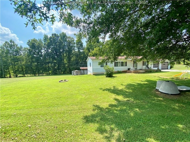 view of yard featuring an attached garage