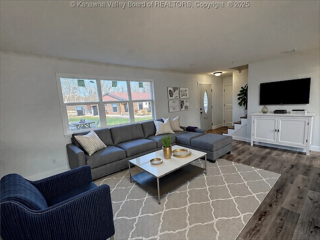 living room with wood finished floors and baseboards