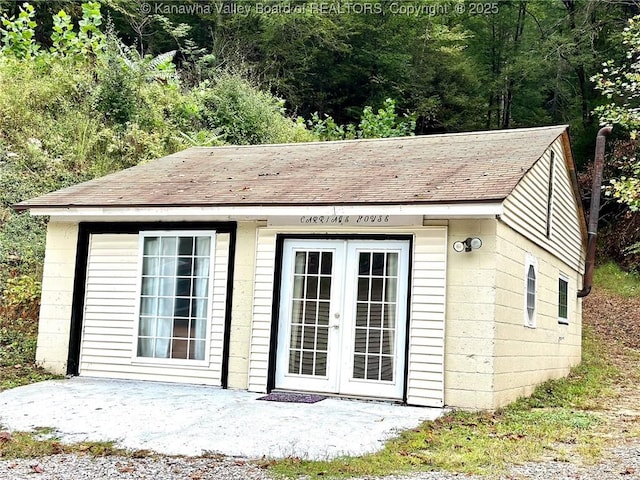 view of outbuilding with french doors and an outdoor structure