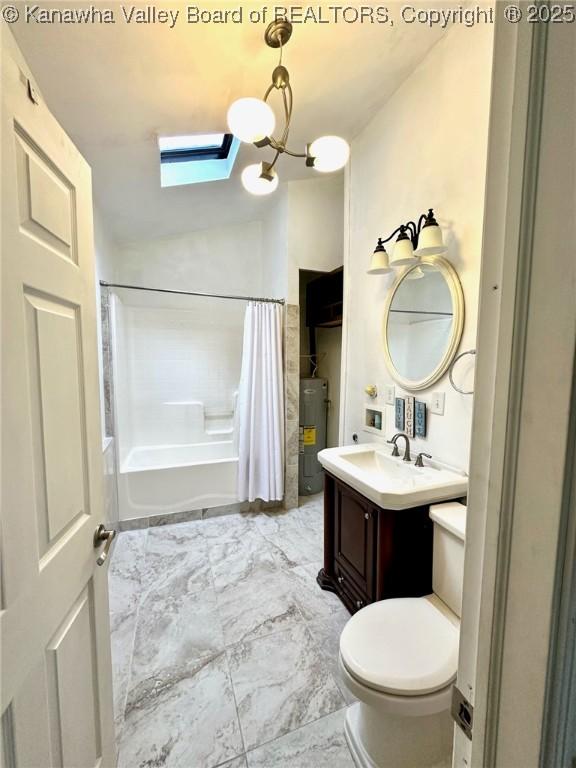 full bath with toilet, electric water heater, marble finish floor, vaulted ceiling, and vanity