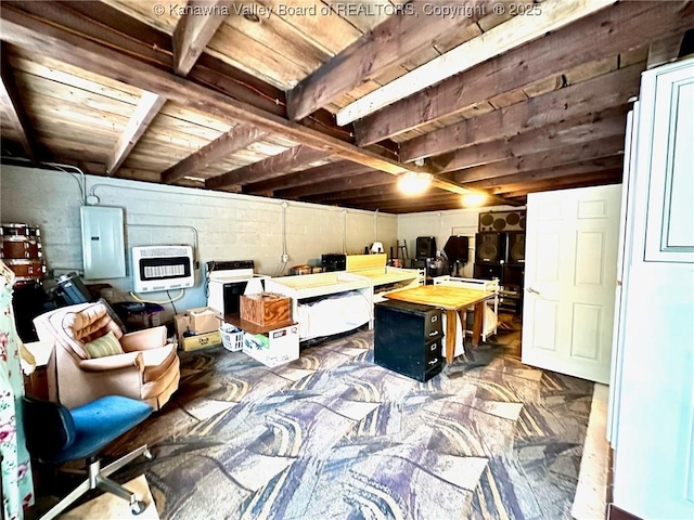 office space with concrete block wall, electric panel, and heating unit