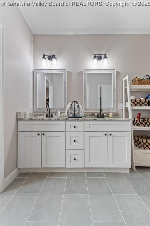 bathroom featuring double vanity and a sink