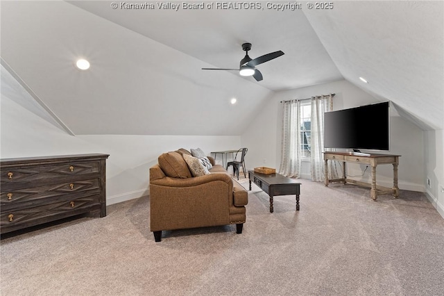 interior space featuring lofted ceiling, baseboards, a ceiling fan, and light colored carpet