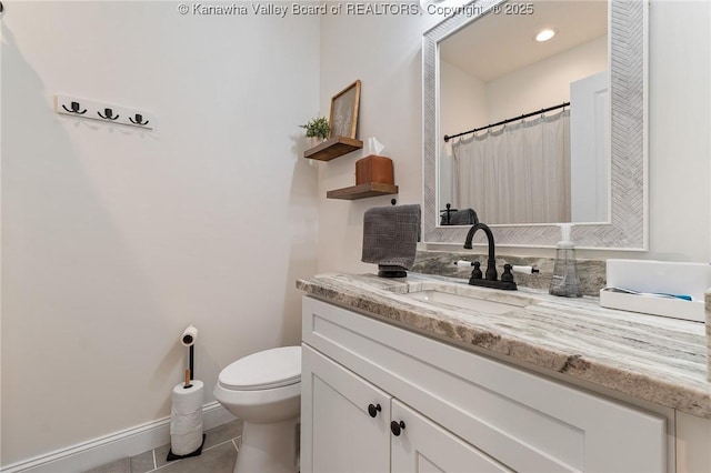 full bath featuring recessed lighting, toilet, vanity, baseboards, and tile patterned floors