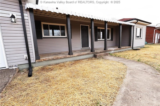 ranch-style home featuring covered porch