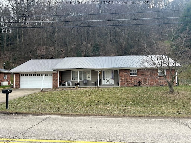 single story home featuring brick siding, a porch, an attached garage, a front yard, and crawl space