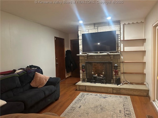 4915 Chesterfield Ave, Charleston, WV 25304 - living area featuring wood finished floors and a stone fireplace