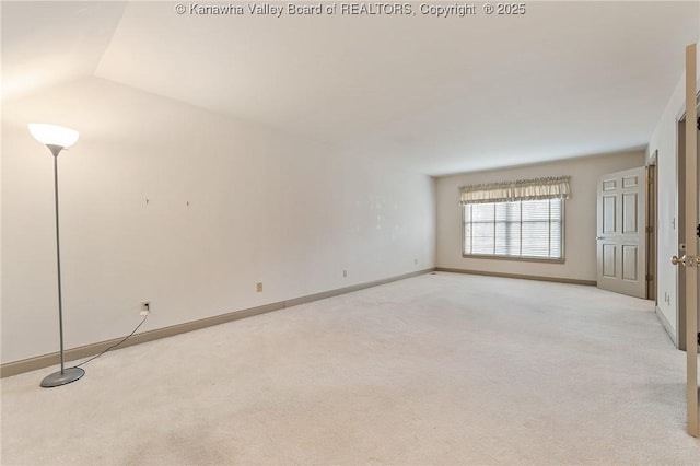 empty room with light carpet and baseboards