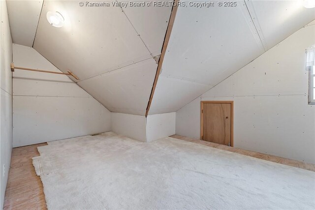 bonus room featuring lofted ceiling