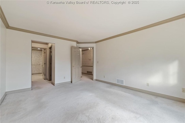 unfurnished bedroom with light carpet, crown molding, visible vents, and baseboards