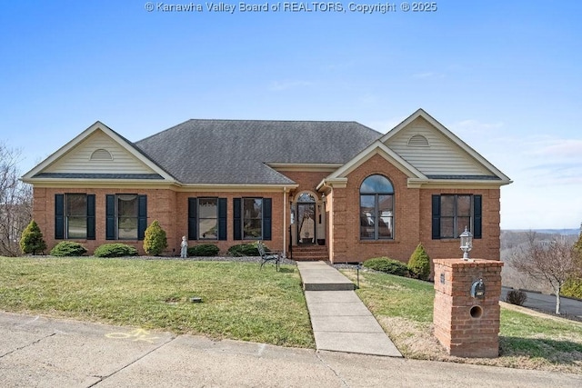 ranch-style house featuring brick siding, roof with shingles, and a front yard