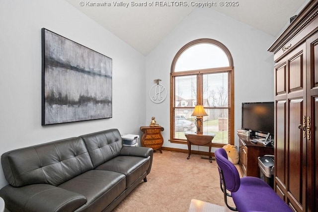 home office featuring light colored carpet, vaulted ceiling, and baseboards