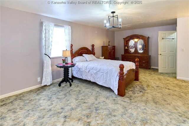 carpeted bedroom with baseboards and a notable chandelier