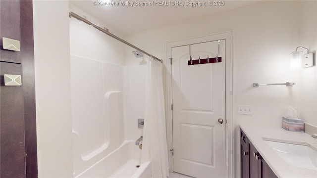 full bathroom featuring shower / tub combo with curtain and vanity