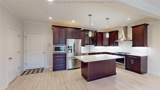 kitchen with stainless steel appliances, light countertops, wall chimney exhaust hood, light wood finished floors, and crown molding