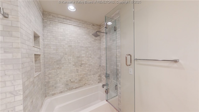 bathroom featuring shower / bath combination with glass door