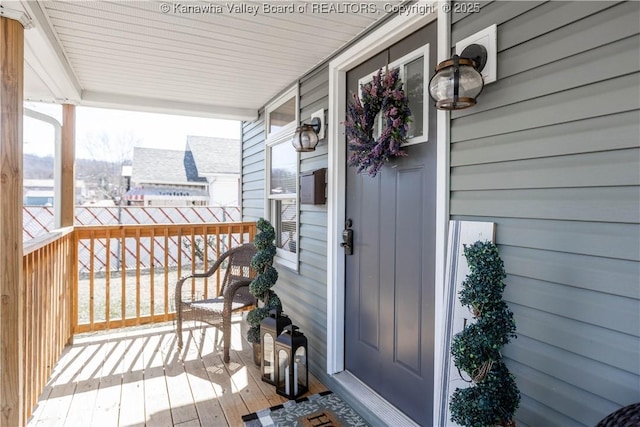 wooden terrace featuring a porch