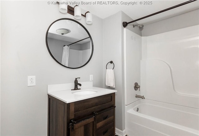 bathroom featuring vanity and shower / bath combo with shower curtain