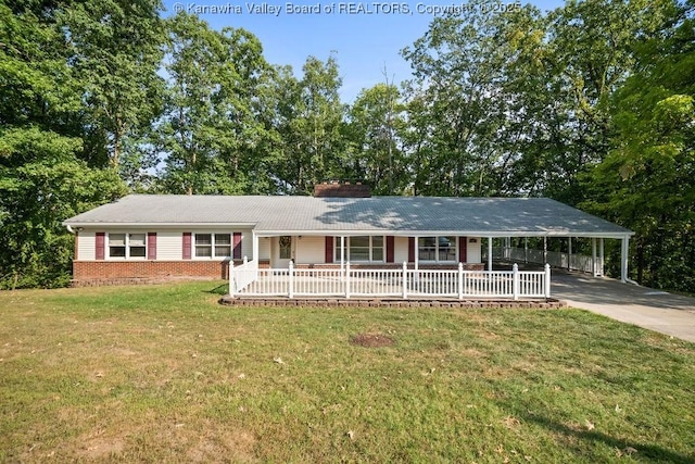 ranch-style home with brick siding, a porch, concrete driveway, a front yard, and a chimney