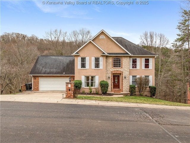 view of front of house featuring stucco siding, driveway, stone siding, roof with shingles, and an attached garage